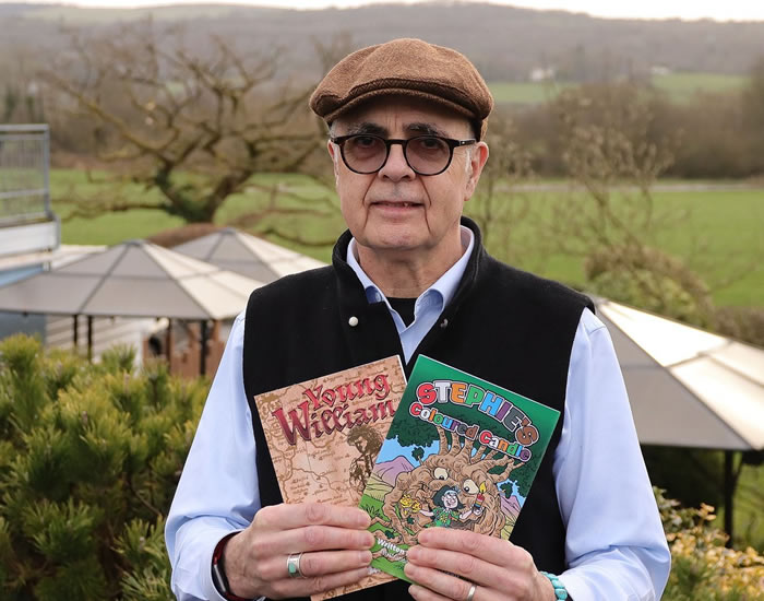 Author holding books